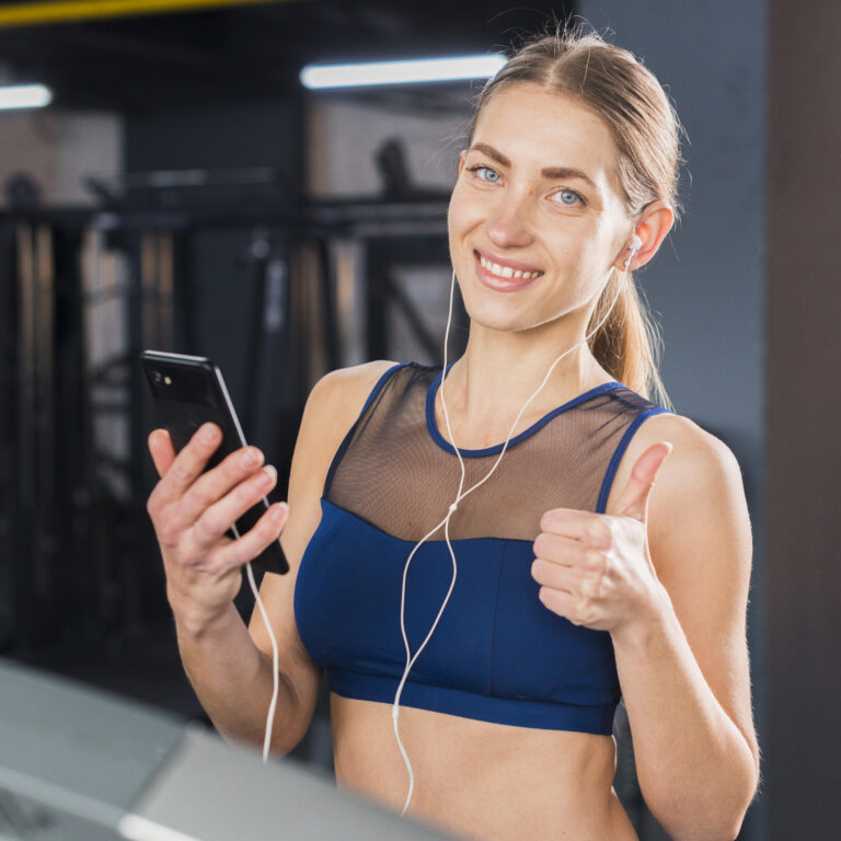 woman-using-smartphone-gym